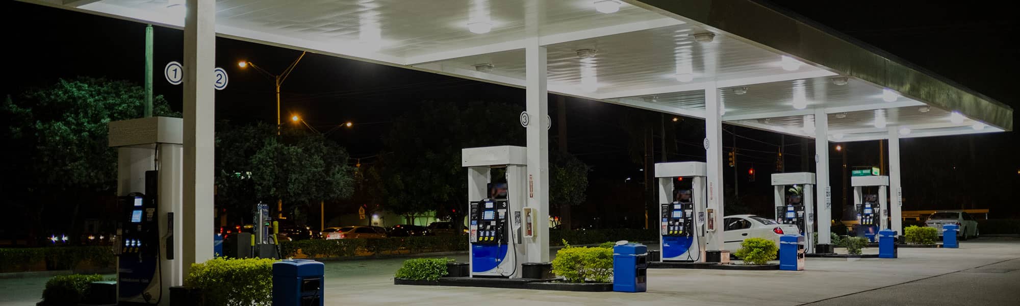 Petrol station forecourt at night